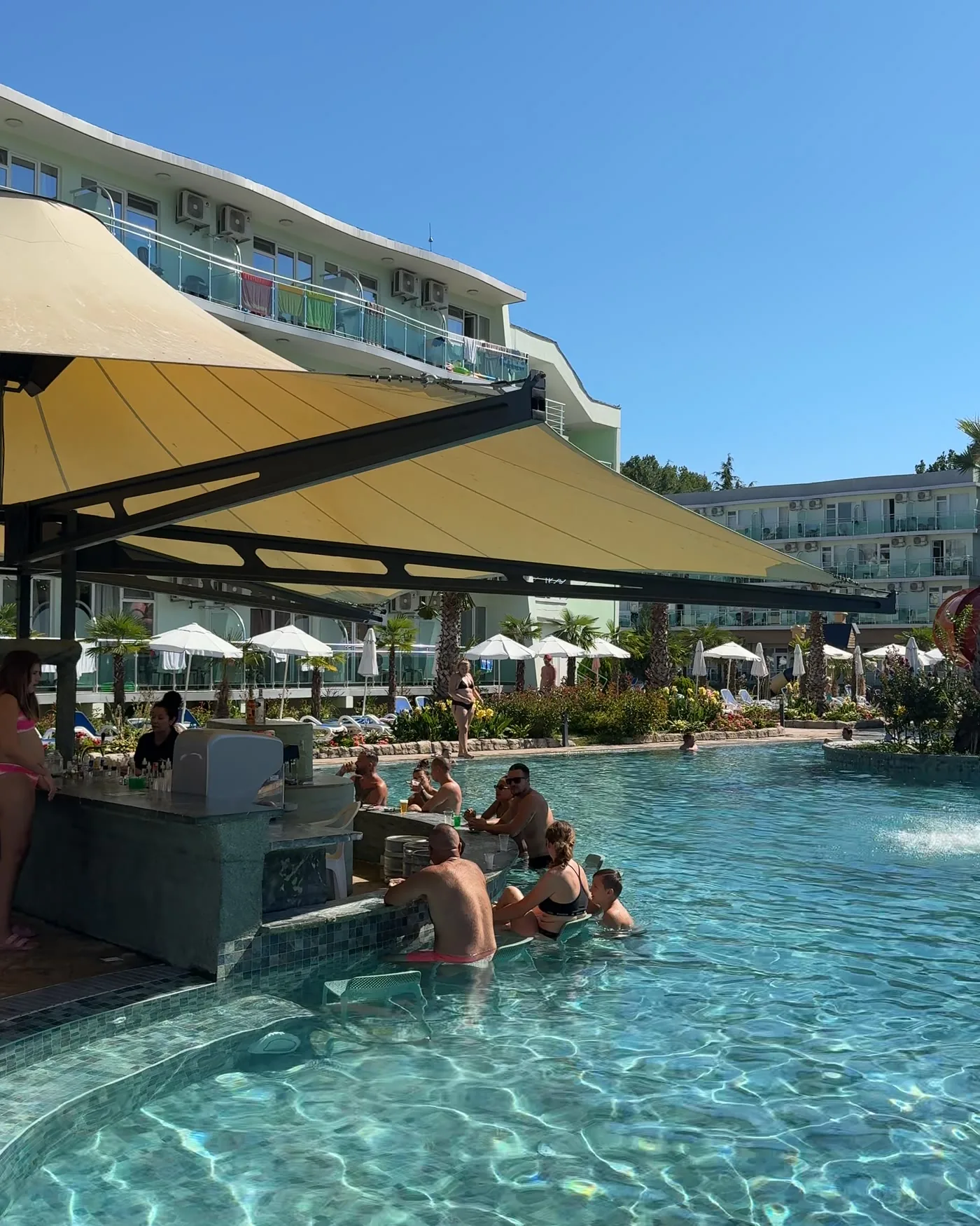 Guests swimming in the lagoon pool at Hotel Kotva